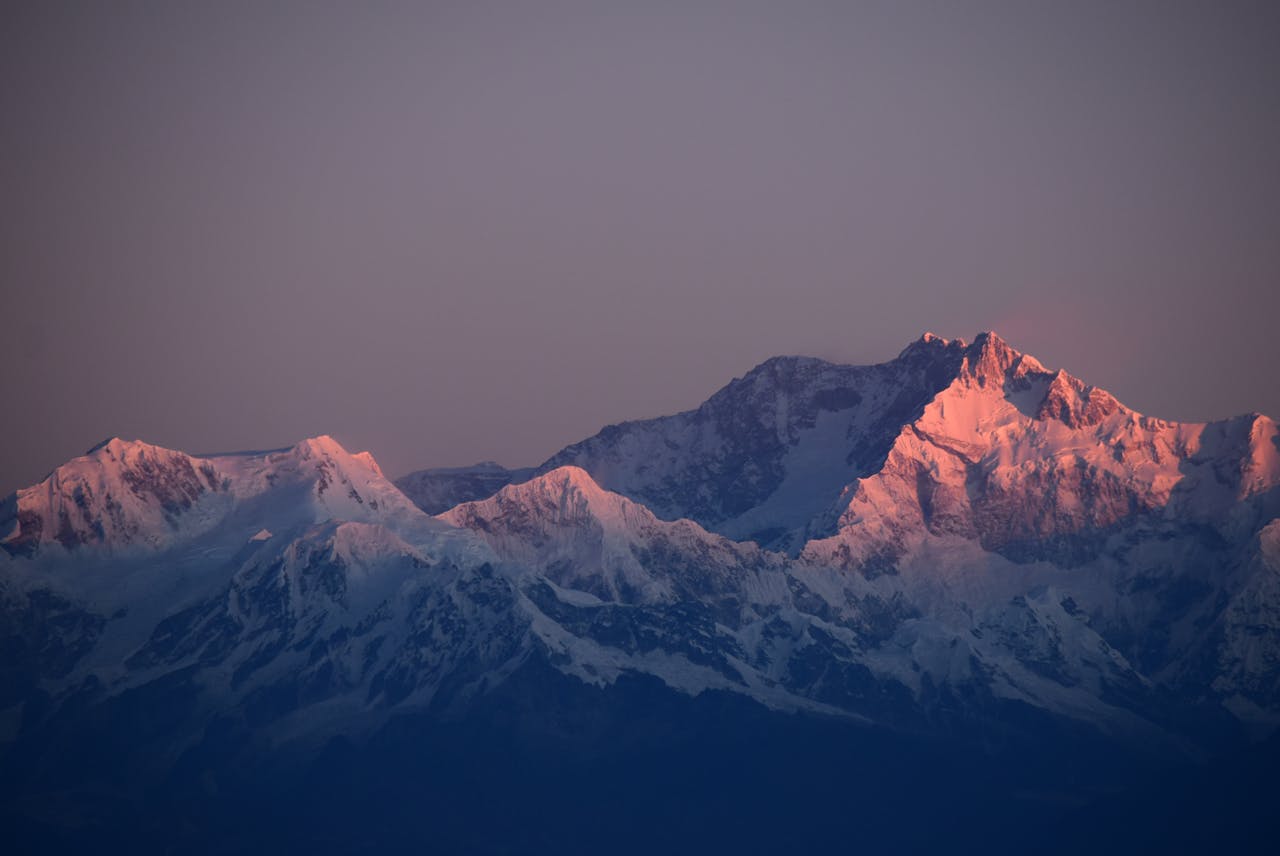 Breathtaking sunset view of snow-capped mountains in Nepal, perfect for scenic backgrounds.